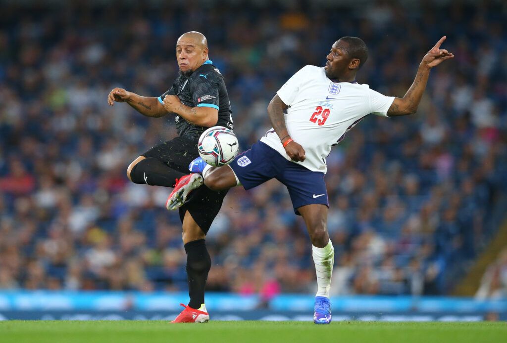 Shaun Wright-Phillips of England challenges Roberto Carlos of Soccer Aid World XI during Soccer Aid for Unicef 2021 match between England and Soccer Aid World XI at Etihad Stadium on September 04, 2021 in Manchester, England.