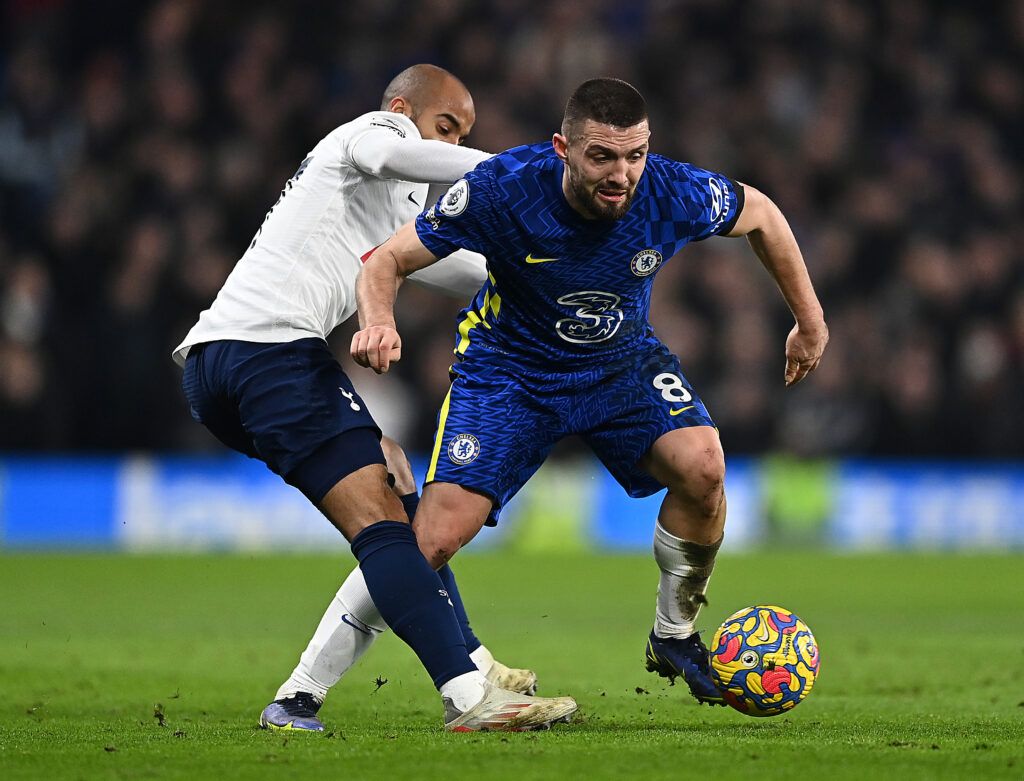 Mateo Kovacic of Chelsea is challenged by Lucas Moura of Tottenham Hotspur during the Premier League match between Chelsea  and  Tottenham Hotspur at Stamford Bridge on January 23, 2022 in London, England