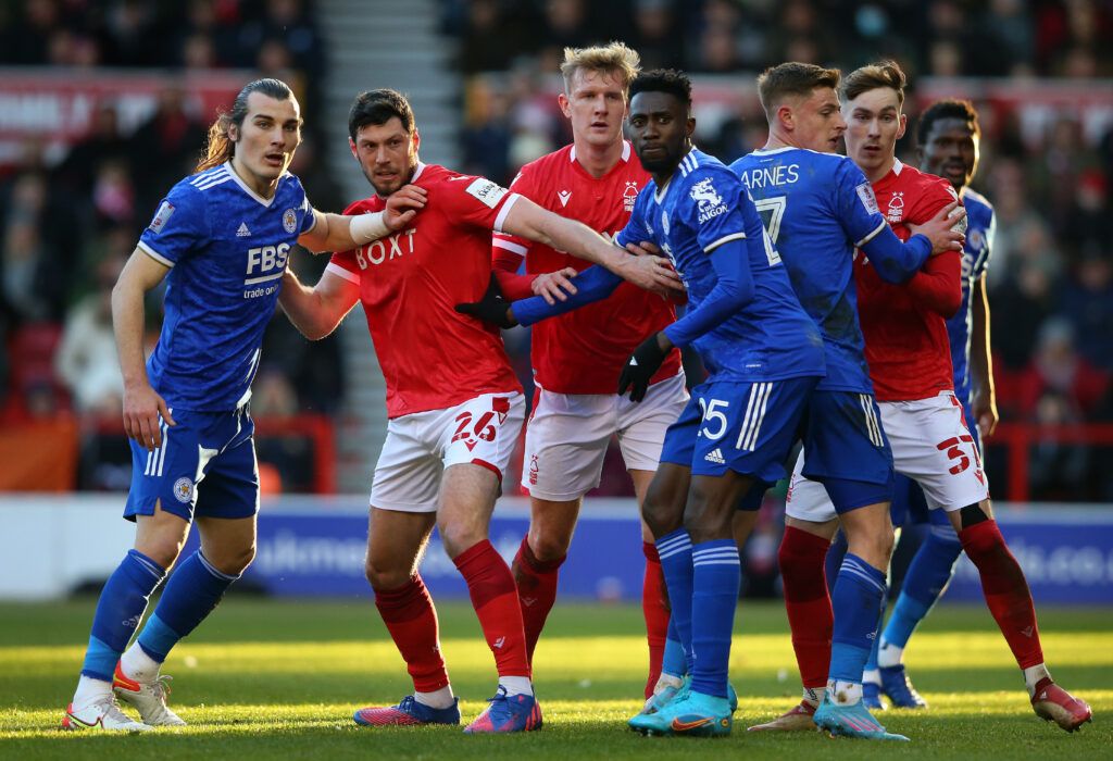 The players of Nottingham Forest and Leicester City jostle for position during a corner in the Emirates FA Cup Fourth Round match between Nottingham Forest and Leicester City at City Ground on February 06, 2022 in Nottingham, England