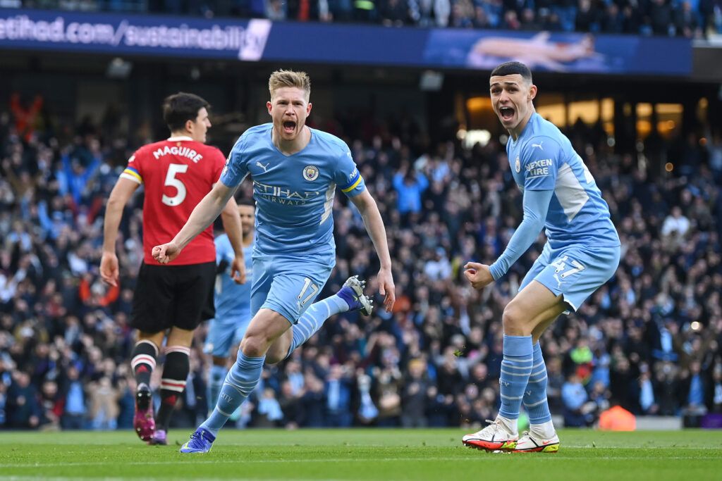 Kevin De Bruyne and Phil Foden celebrate scoring for Manchester City against Manchester United