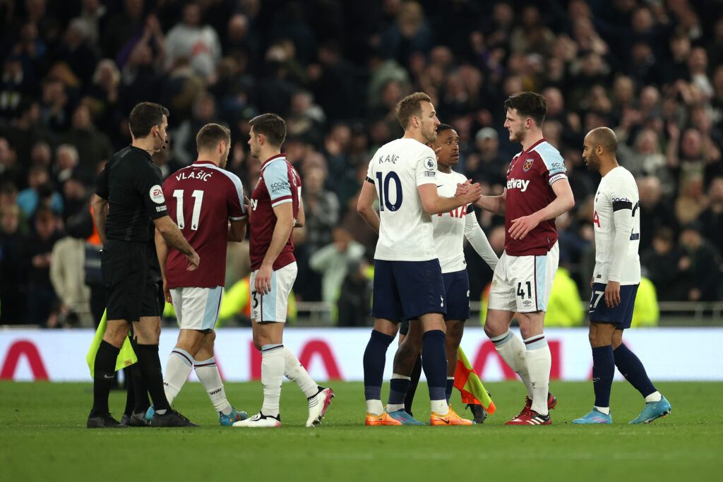 Harry Kane of Tottenham Hotspur shakes hands with Declan Rice of West Ham United following the Premier League match between Tottenham Hotspur and West Ham United at Tottenham Hotspur Stadium on March 20, 2022 in London, England