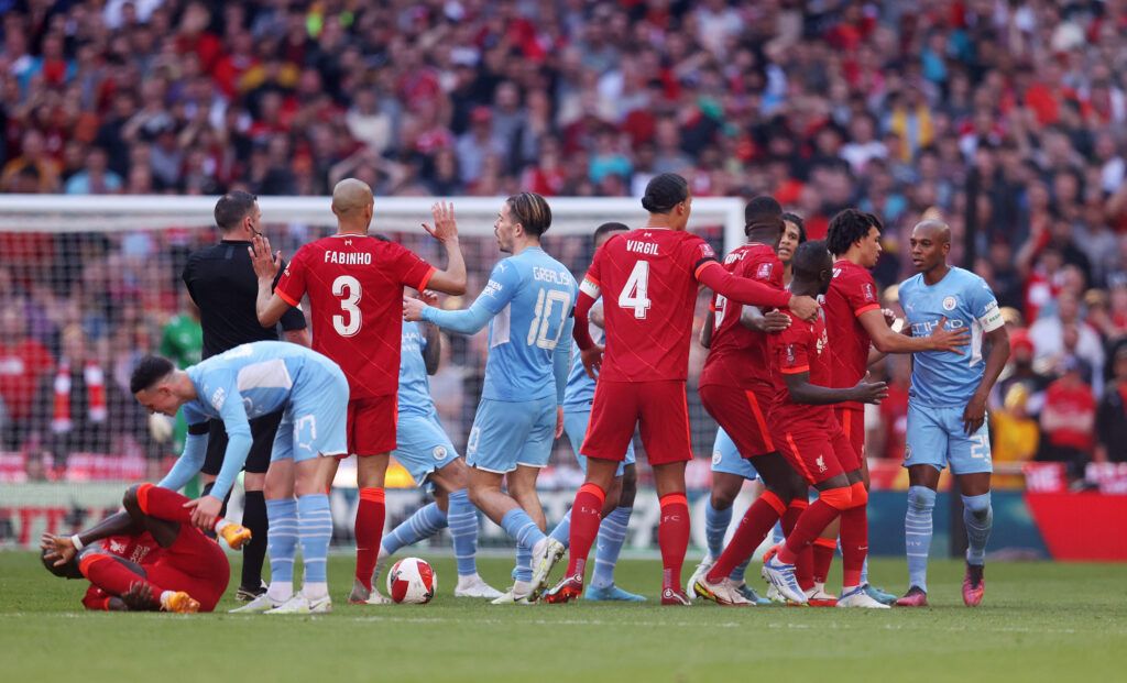 Fernandinho of Manchester City clashes with Naby Keita of Liverpool during The Emirates FA Cup Semi-Final match between Manchester City and Liverpool at Wembley Stadium on April 16, 2022 in London, England.