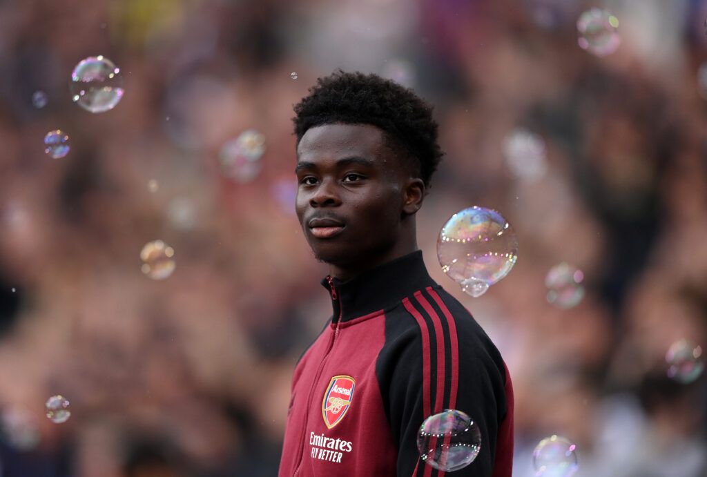 Bukayo Saka of Arsenal walks out for the the Premier League match between West Ham United and Arsenal at London Stadium on May 01, 2022 in London, England.