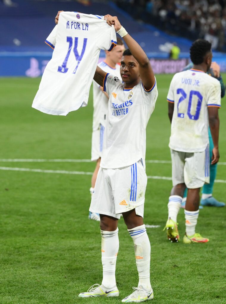 Rodrygo holds up 'A por la 14' shirt after Real Madrid beat Man City in the Champions League