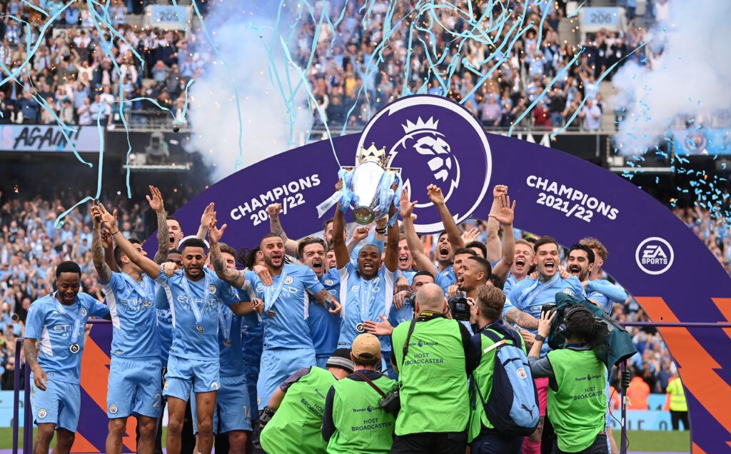 Manchester City captain Fernandinho lifts the Premier League Trophy and celebrates with the squad after the Premier League match between Manchester City and Aston Villa at Etihad Stadium on May 22, 2022 in Manchester, England.