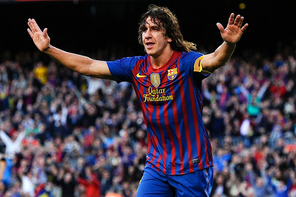 Carles Puyol celebrates a goal for Barcelona