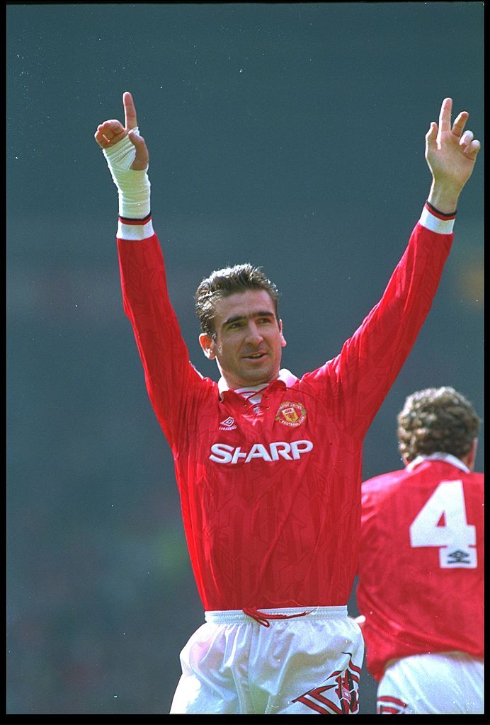 Eric Cantona in action with Man Utd