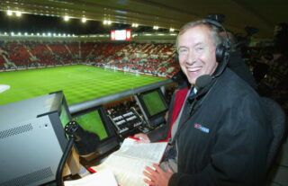 Sky television commentator Martin Tyler in the commentary box