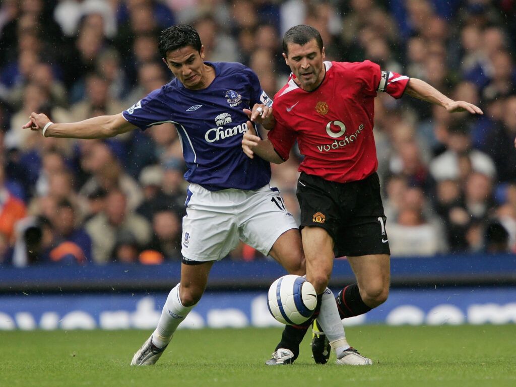 Roy Keane tussles with Tim Cahill