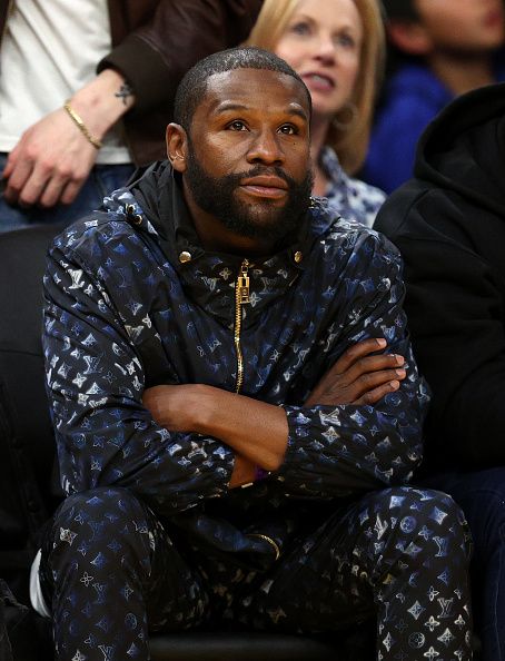 Mayweather watches a basketball game.