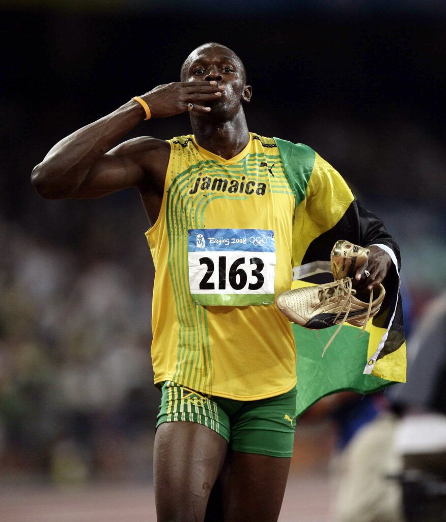 Bolt with the Jamaican flag.