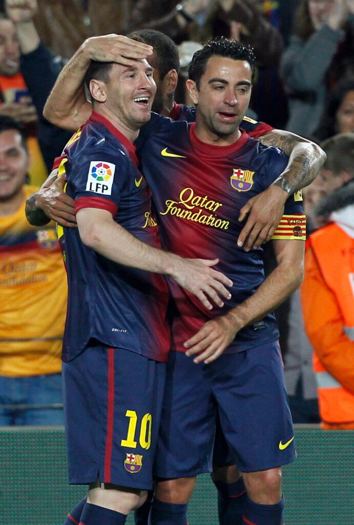 Messi and Xavi at Barcelona.
