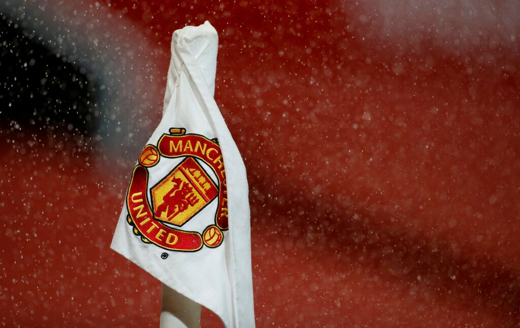 Man Utd's badge in the rain.