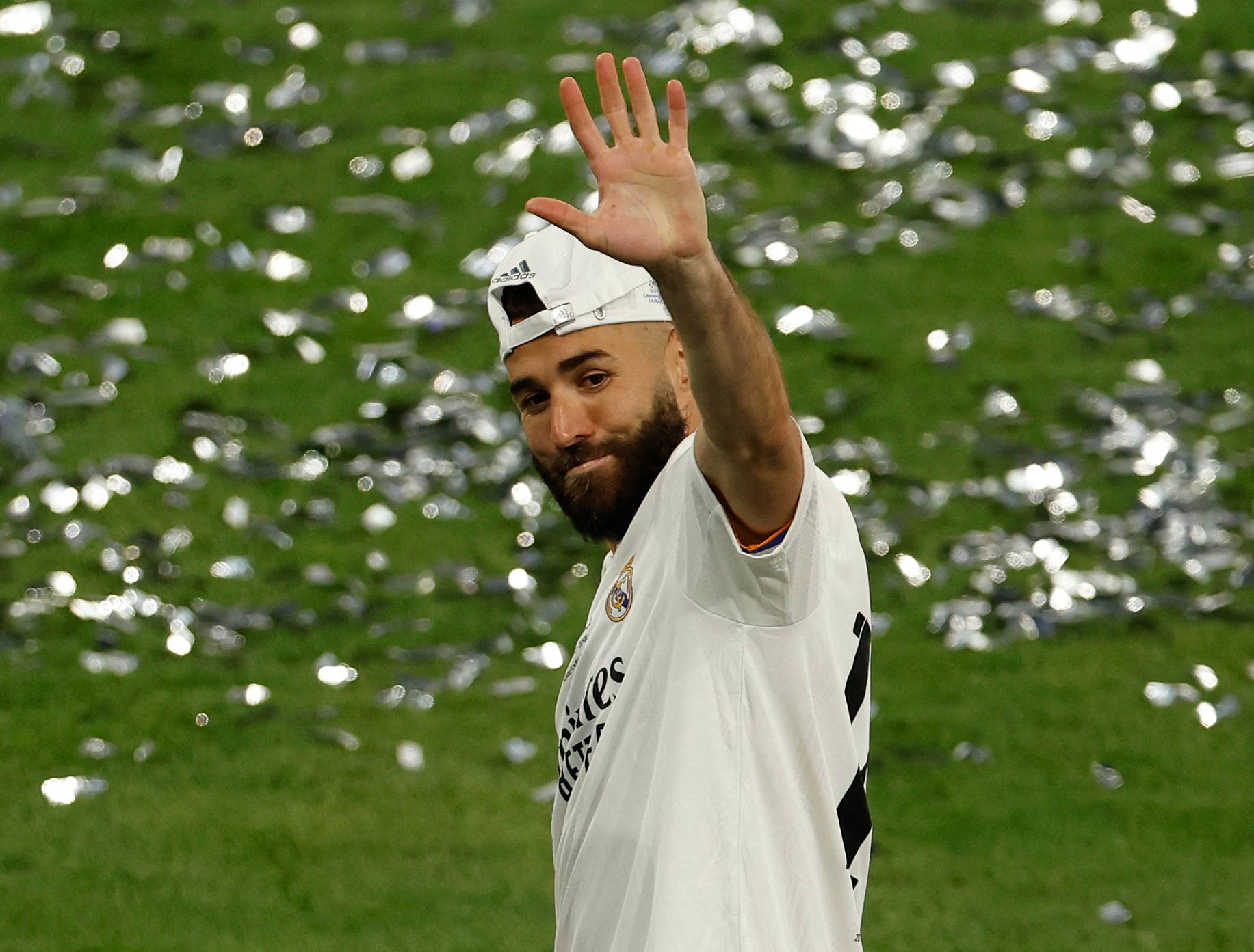 Real Madrid's Benzema waves.