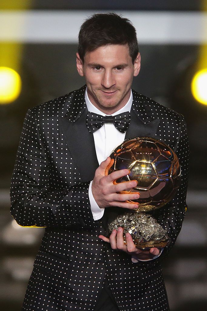 Lionel Messi with the 2012 Ballon d'Or trophy