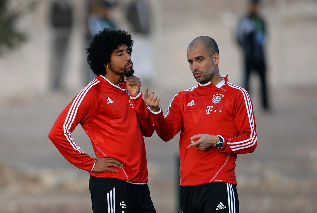 Dante and Guardiola in conversation on the training ground