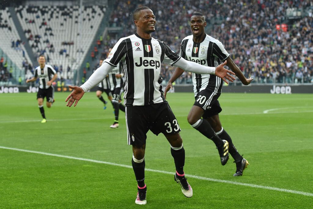 Evra celebrates with Pogba for Juventus