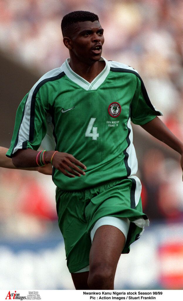 Kanu wearing No. 4 for Nigeria.