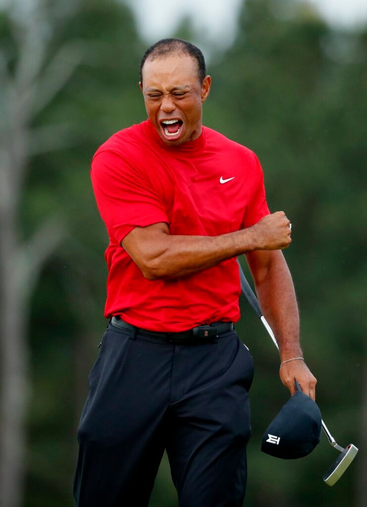 Woods celebrates at the Masters.