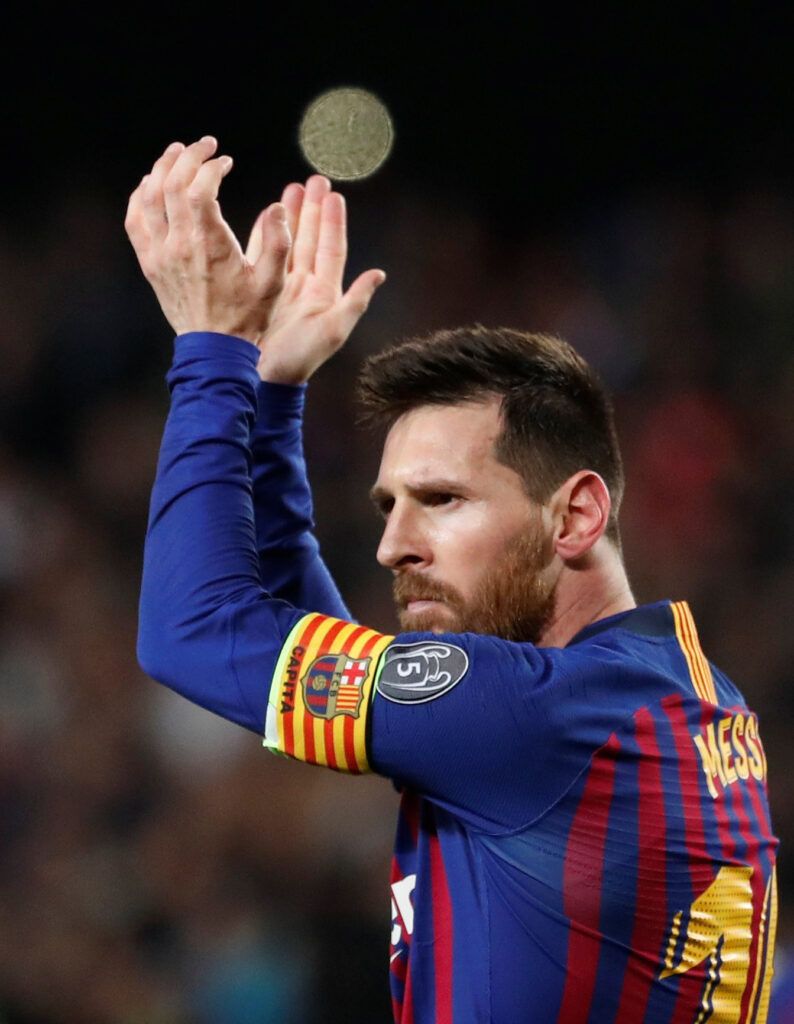 Messi captaining Barcelona.