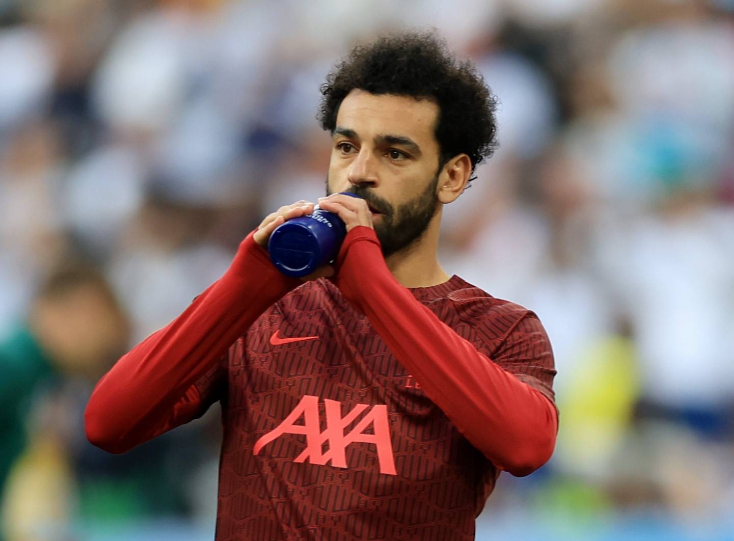 Liverpool's Salah takes a drink.