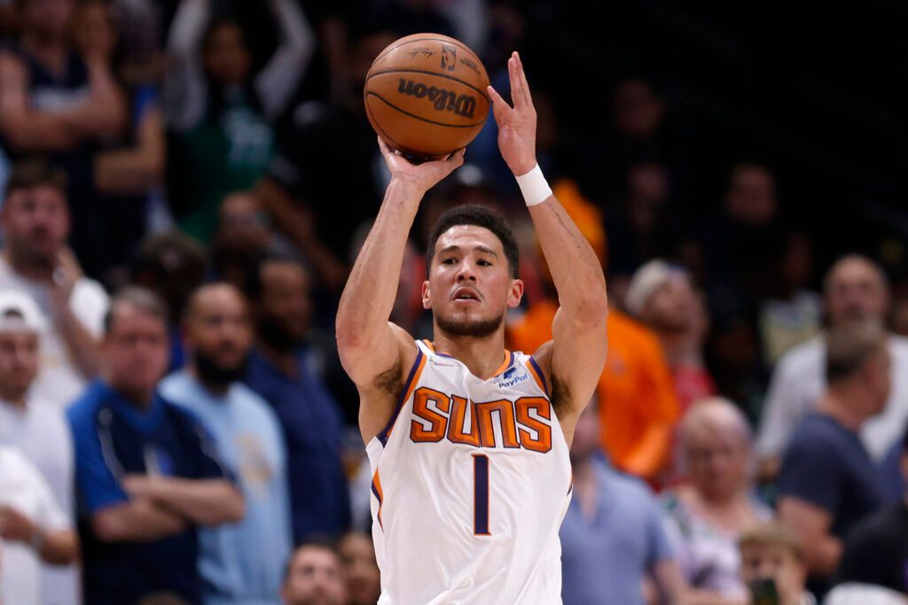 Devin Booker #1 of the Phoenix Suns shoots the ball against Dwight Powell #7 of the Dallas Mavericks in the second quarter of Game Six of the 2022 