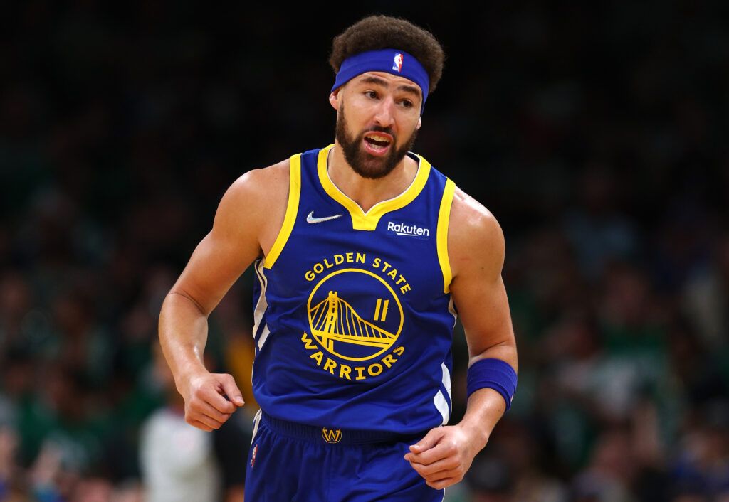  Klay Thompson #11 of the Golden State Warriors celebrates a three pointer against the Boston Celtics during the first quarter in Game Six of the 2022 NBA Finals