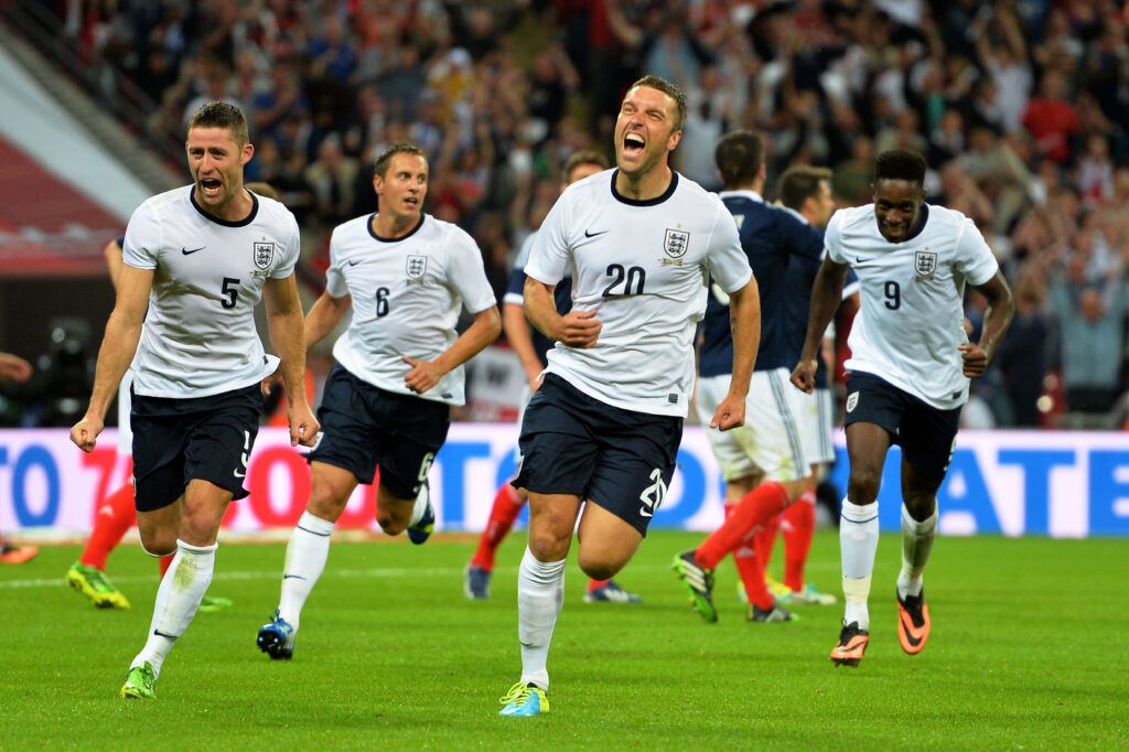 Lambert celebrates scoring for England