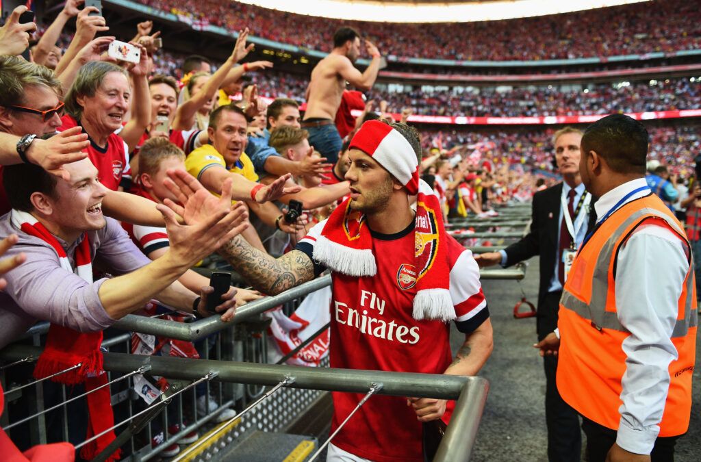 Wilshere celebrates with Arsenal fans
