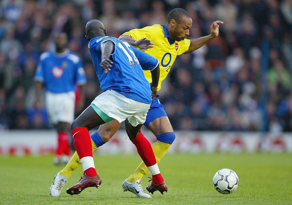 Thierry Henry in action for Arsenal against Portsmouth in 2004