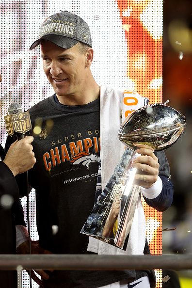 Manning holds the Super Bowl trophy.
