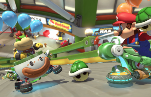 Mario throws shell at Baby Bowser