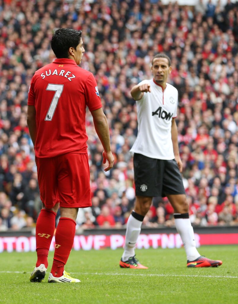 Luis Suarez and Rio Ferdinand tussle in Man Utd vs Liverpool