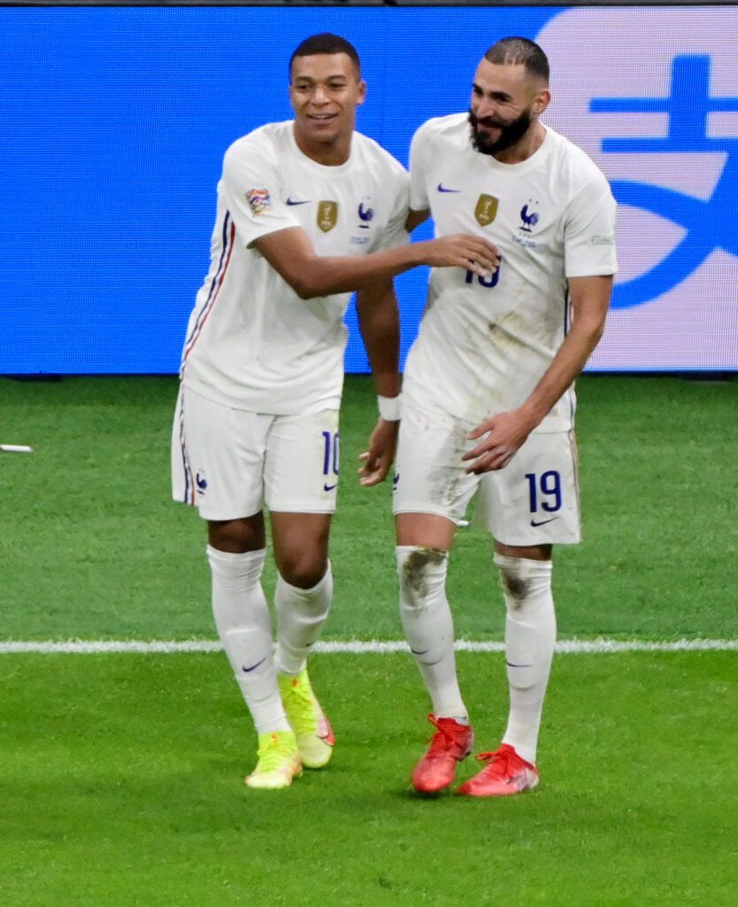 Kylian Mbappe and Karim Benzema celebrate a goal for France