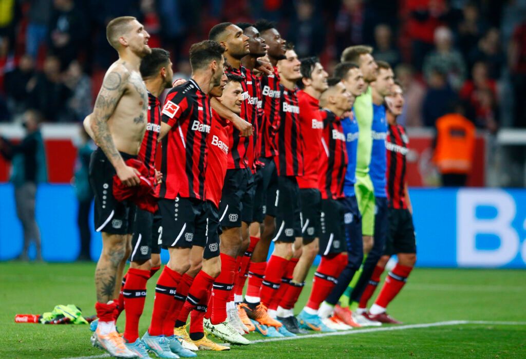 Bayer Leverkusen players celebrate.