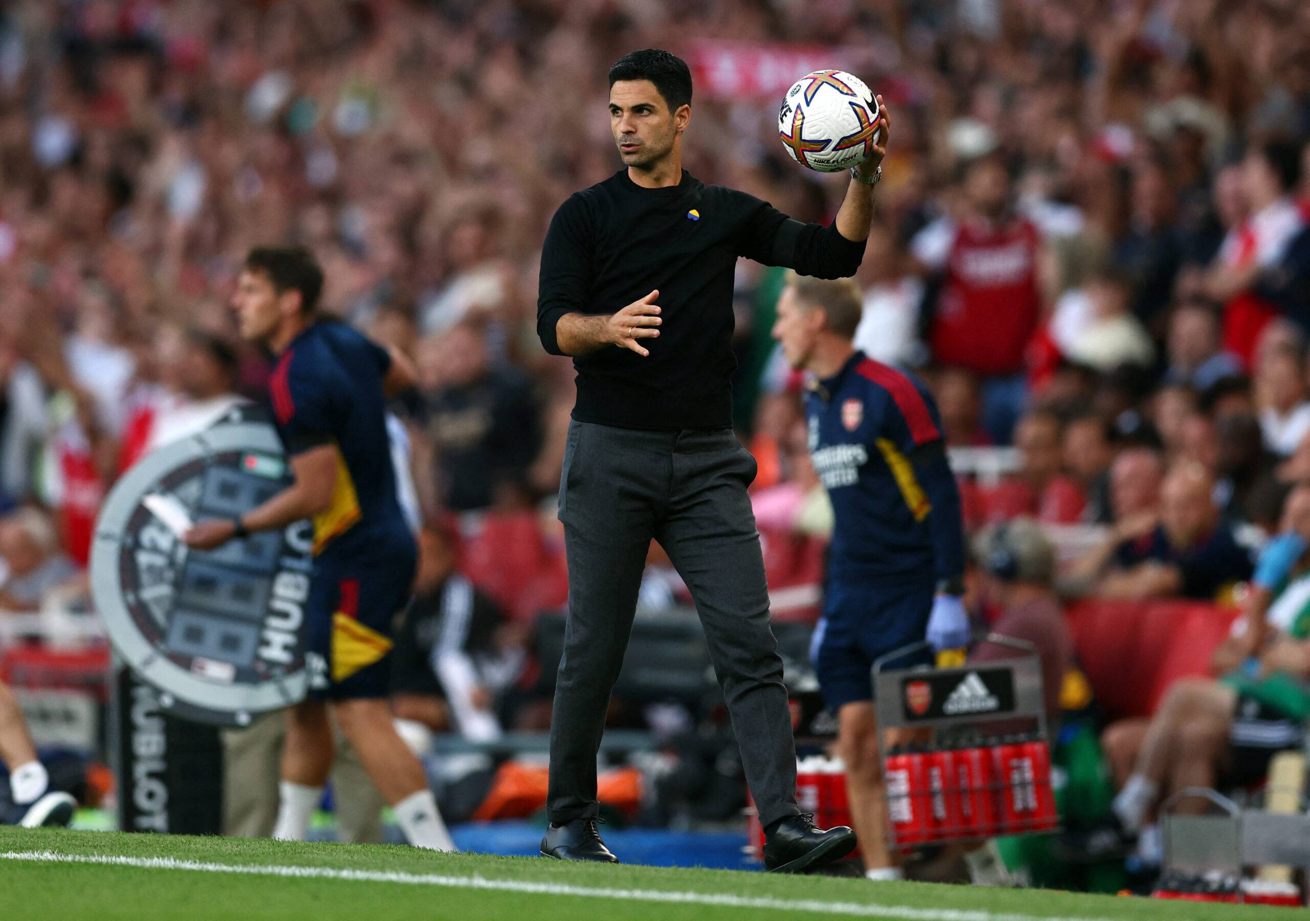 Arsenal boss Mikel Arteta holds the ball