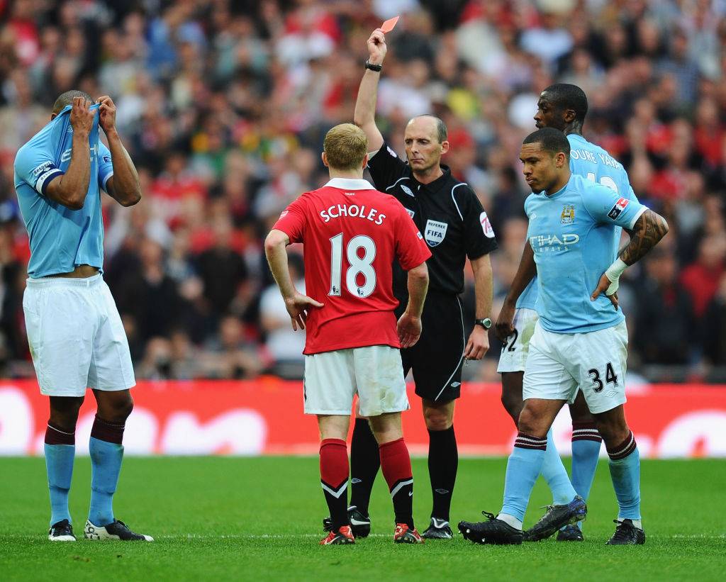 Paul scholes is shown a red card vs Man City