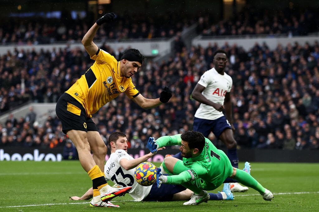 Hugo Lloris of Tottenham Hotspur blocks the shot of Raul Jimenez 