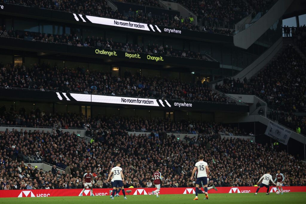 The LED board shows the 'No Room For Racism' message during the Premier League match