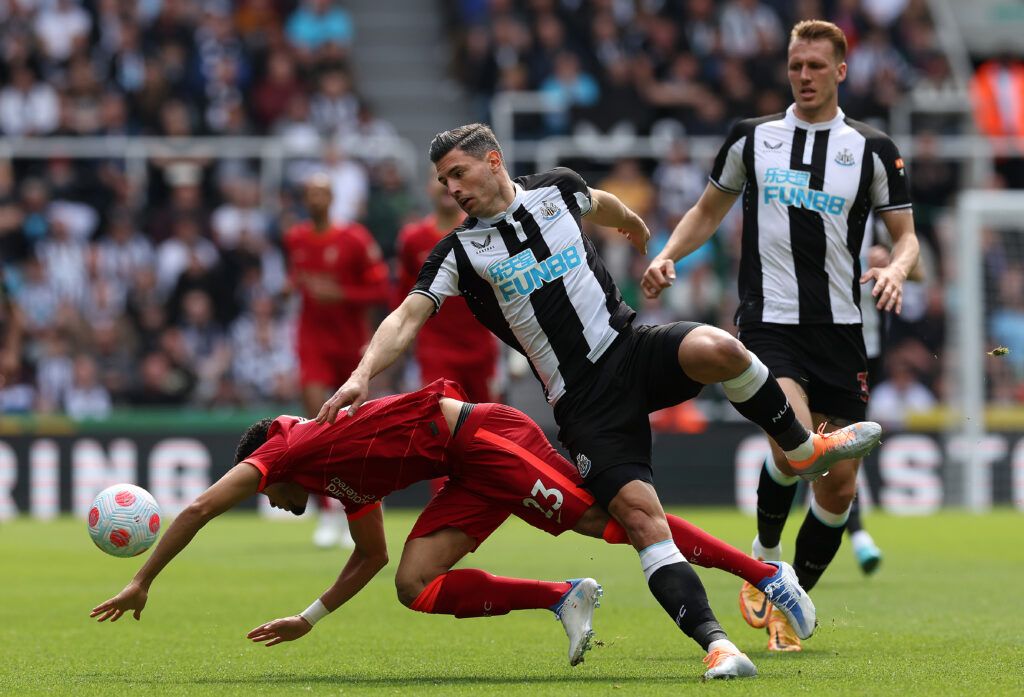 Fabian Schar of Newcastle United vies with Luis Diaz of Liverpool