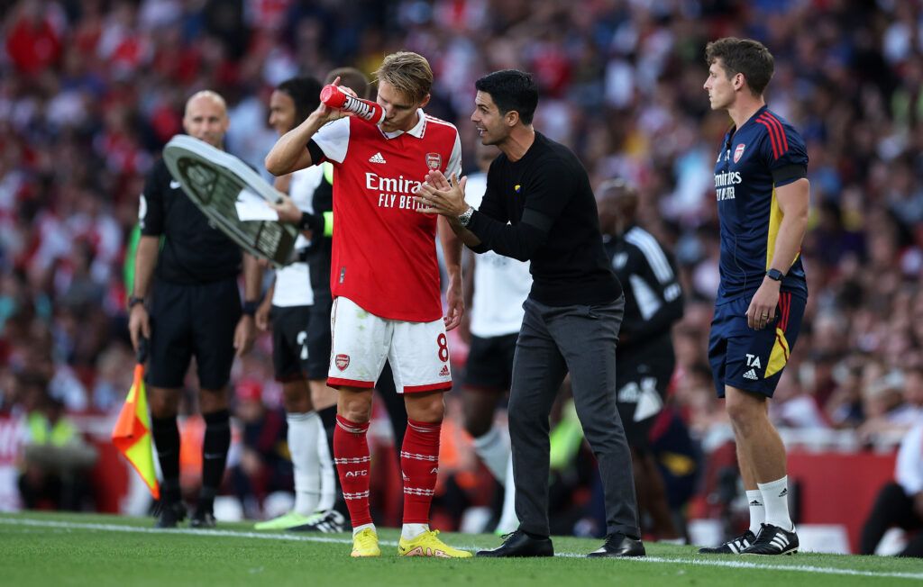 Arsenal's Mikel Arteta and Martin Odegaard on the touchline