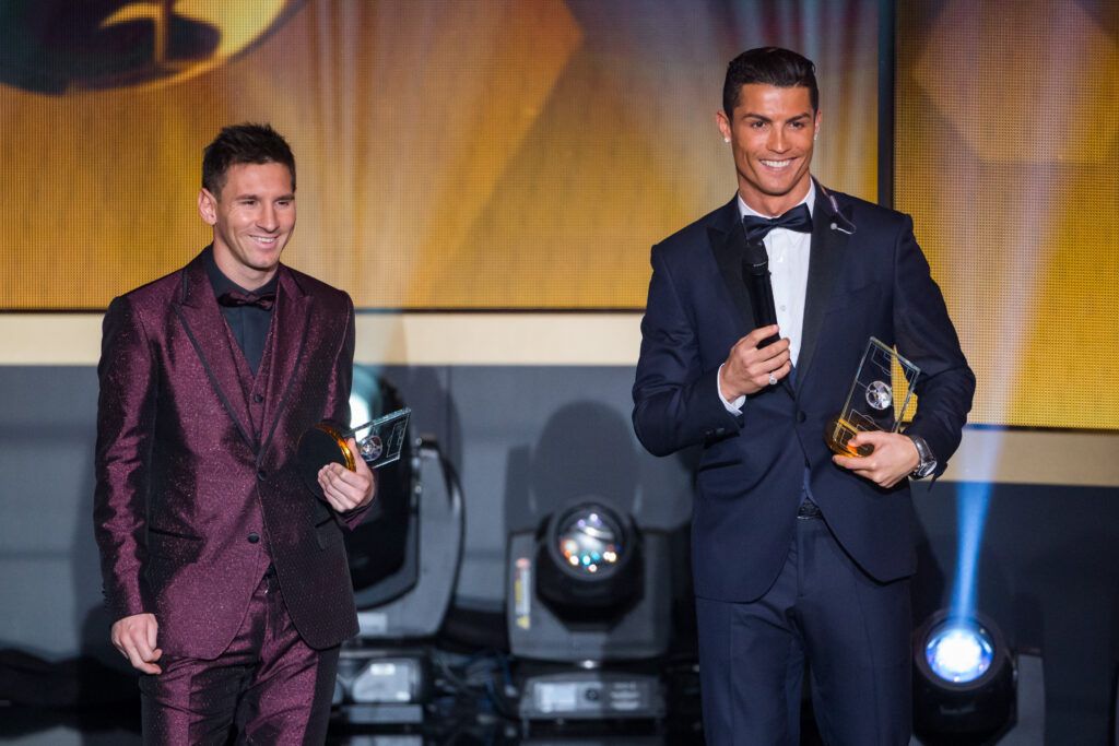 Lionel Messi and Cristiano Ronaldo at an awards ceremony
