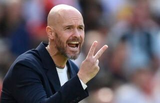 Manchester United boss Erik ten Hag passes instructions onto his players