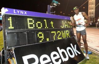 Bolt clocks 9.72 seconds.