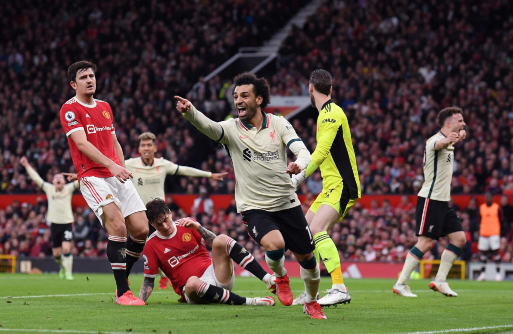 Mohamed Salah celebrates after scoring agaisnt Manchester United