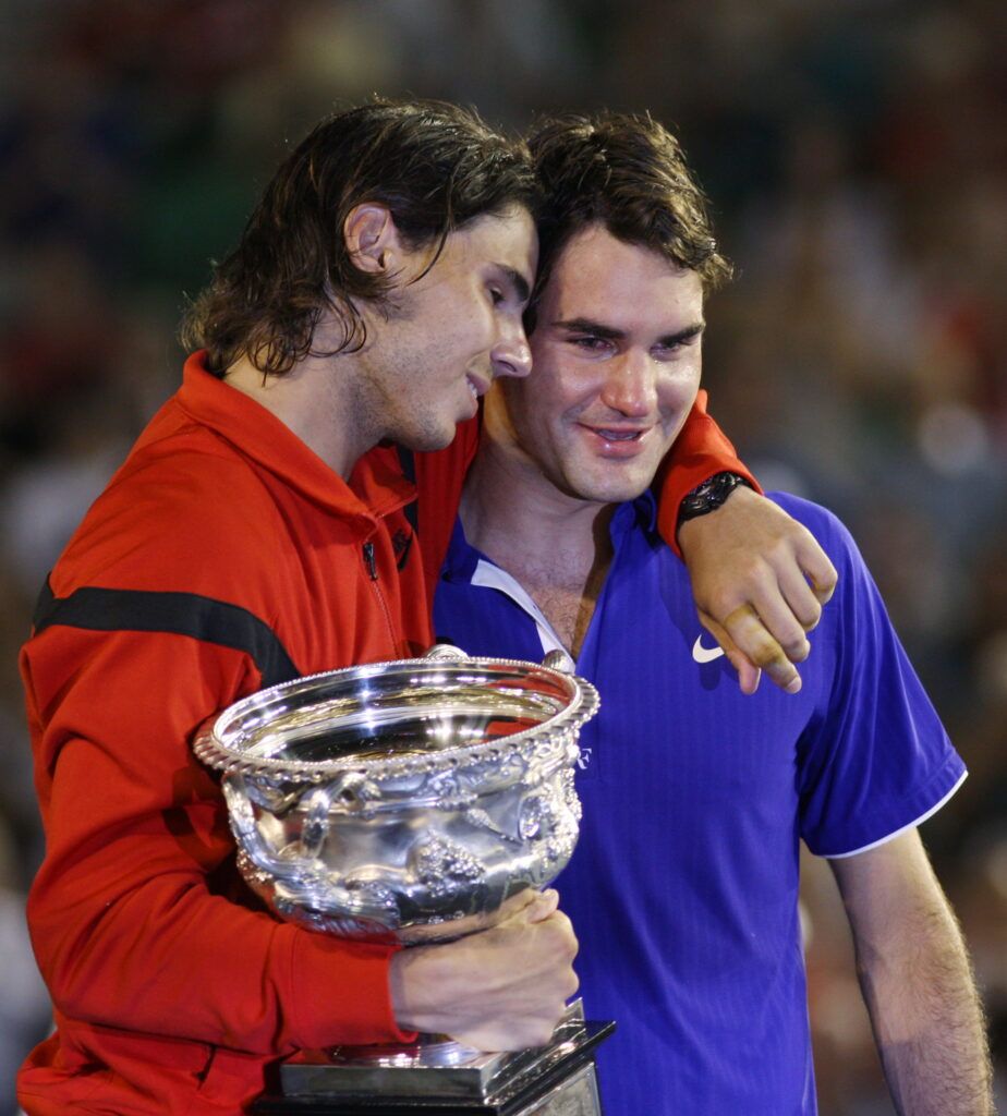 Nadal and Federer embrace.