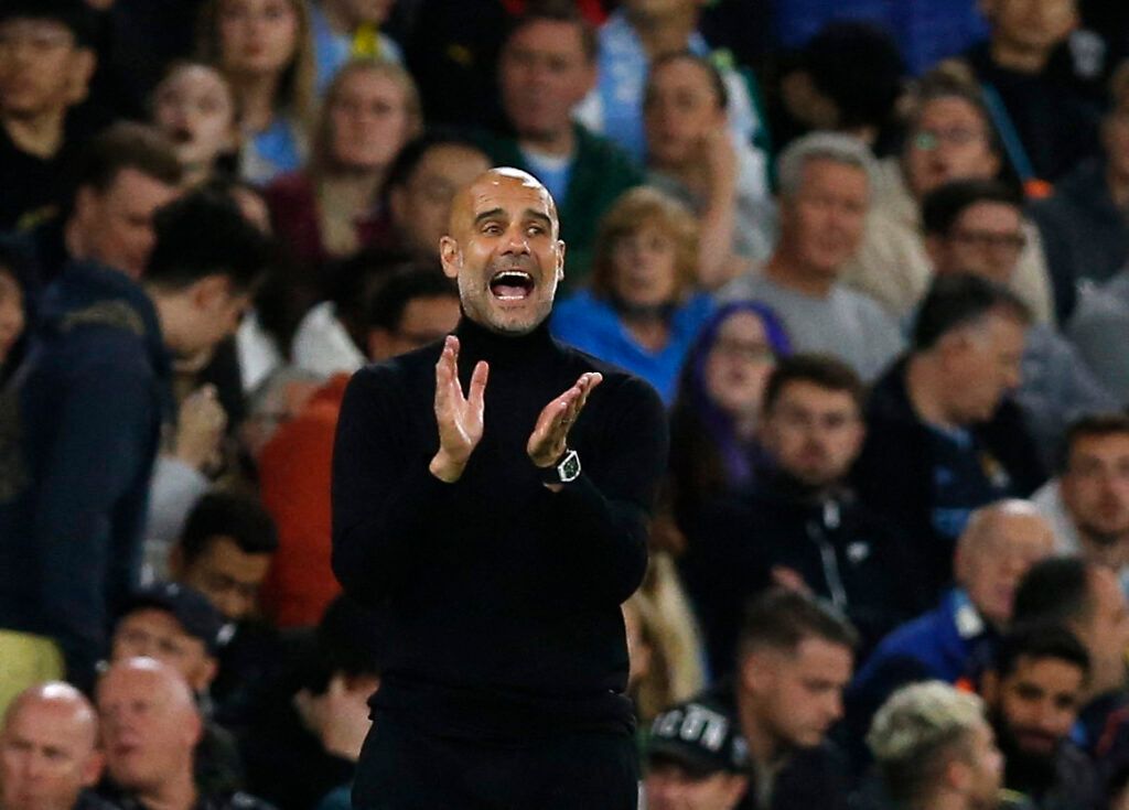 Man City's Guardiola clapping.
