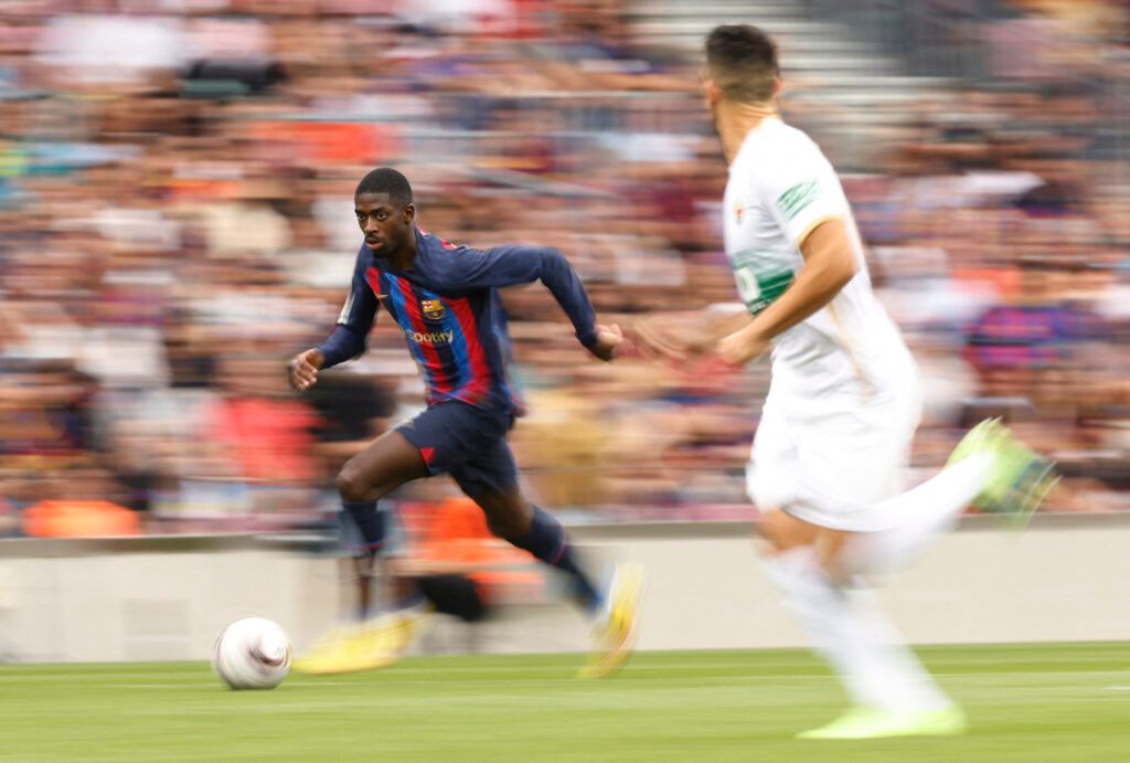 Ousmane Dembele sprinting for Barcelona