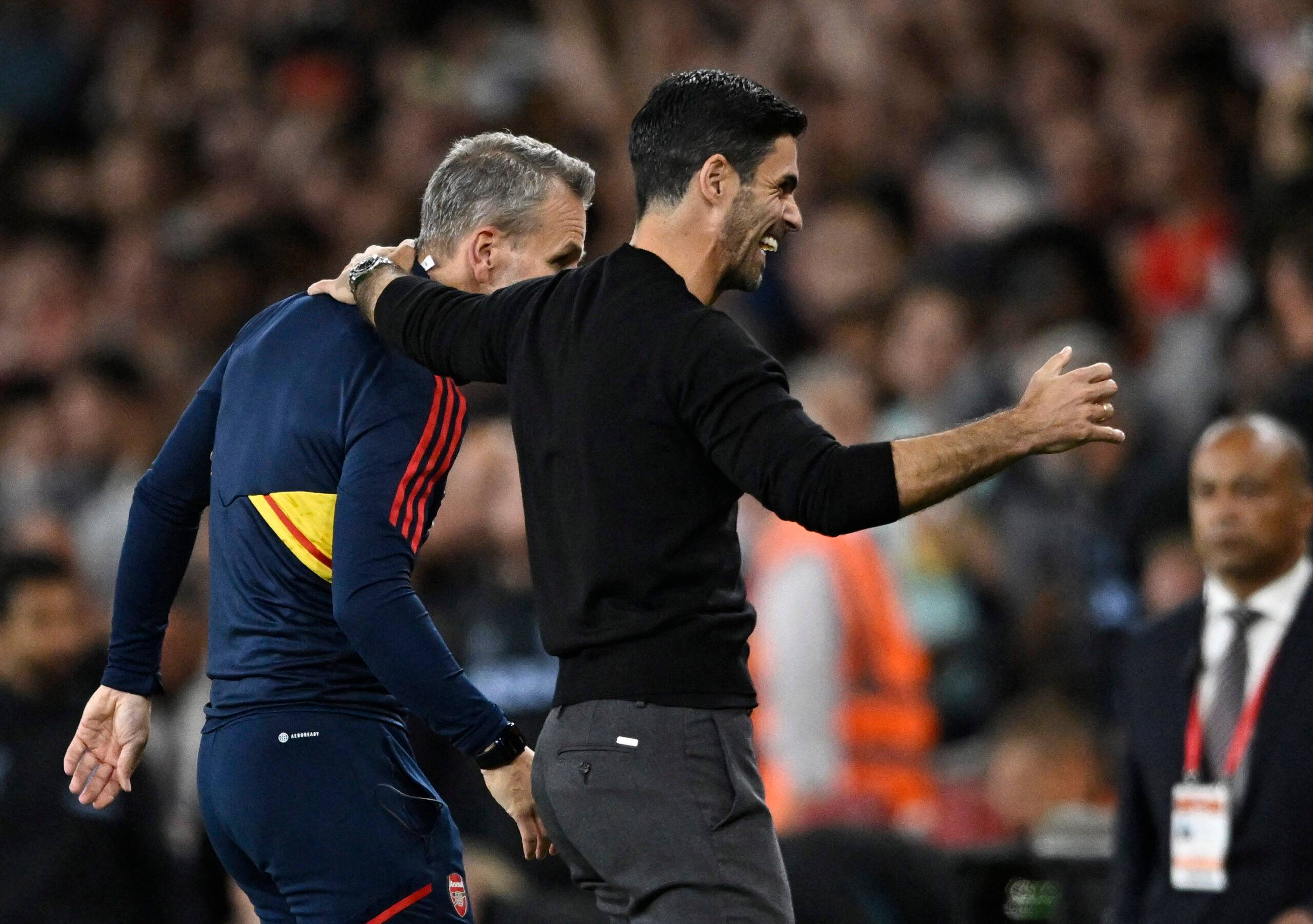 Arsenal manager Mikel Arteta celebrates with assistant manager Albert Stuivenberg