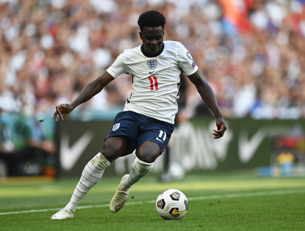 Arsenal's Bukayo Saka on the ball for England